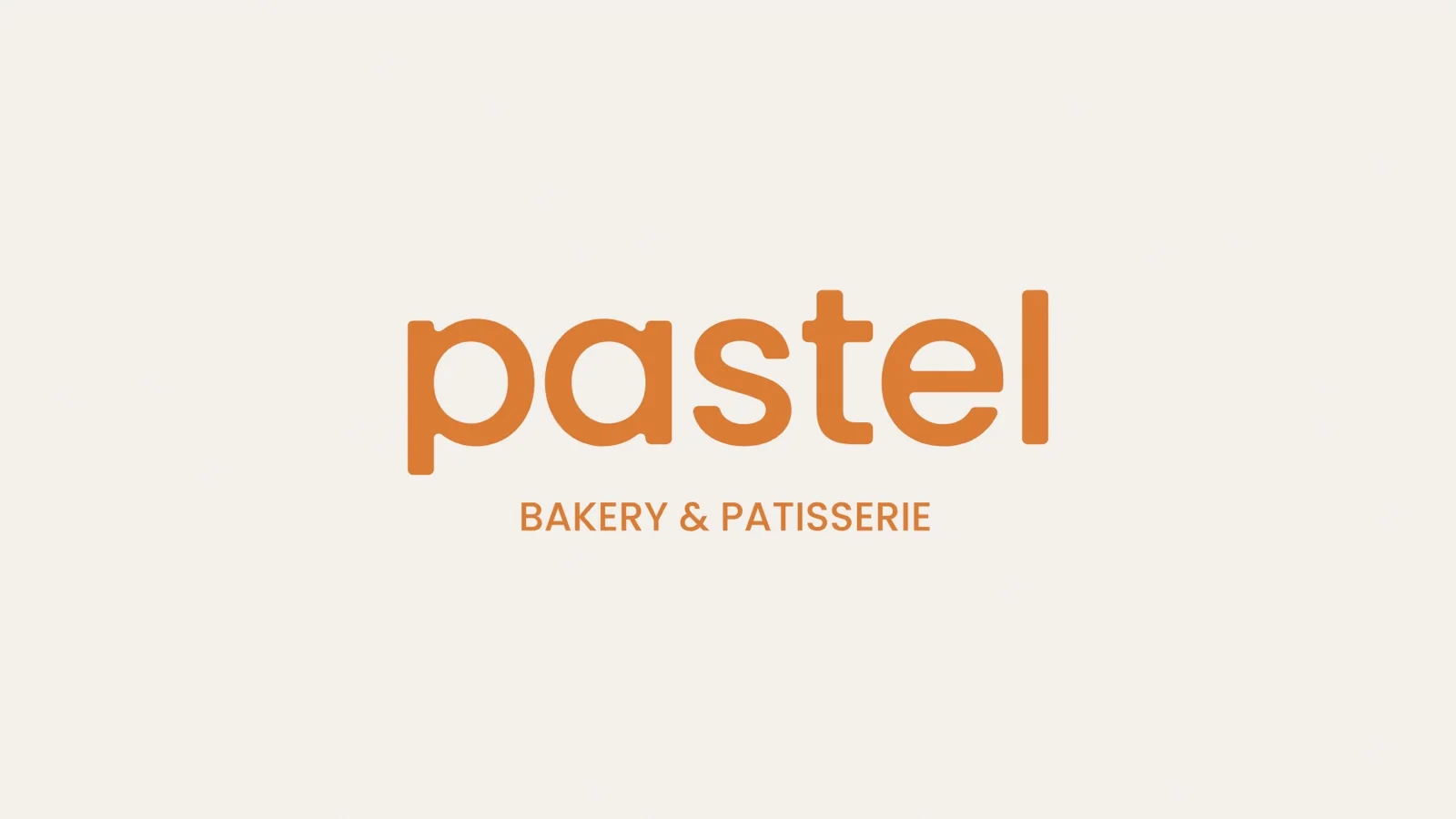 Pastel bakery wordmark in orange on cream